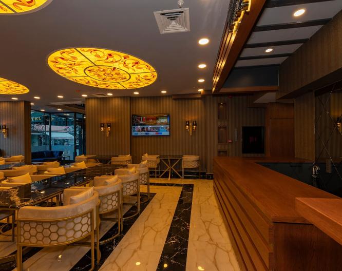 New Emin Hotel - Essen und Trinken